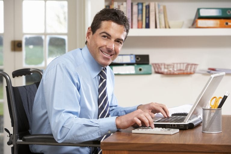 man working from home using laptop